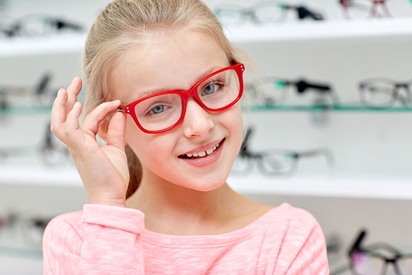 kid holding eyeglasses